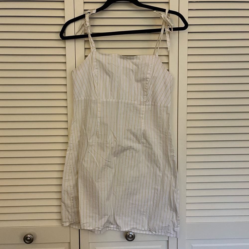 Lottie Moss yellow striped dress with tie straps.